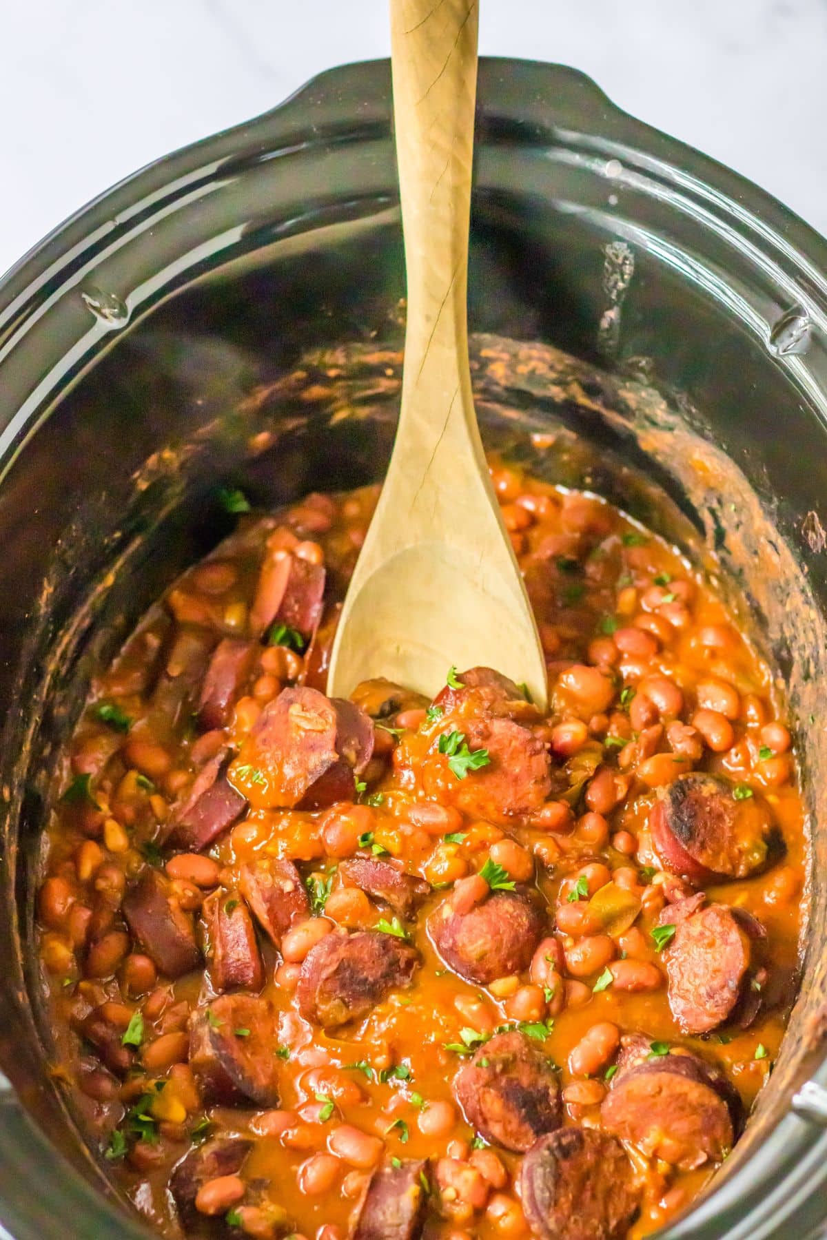 Red beans and sausage in a slow cooker.