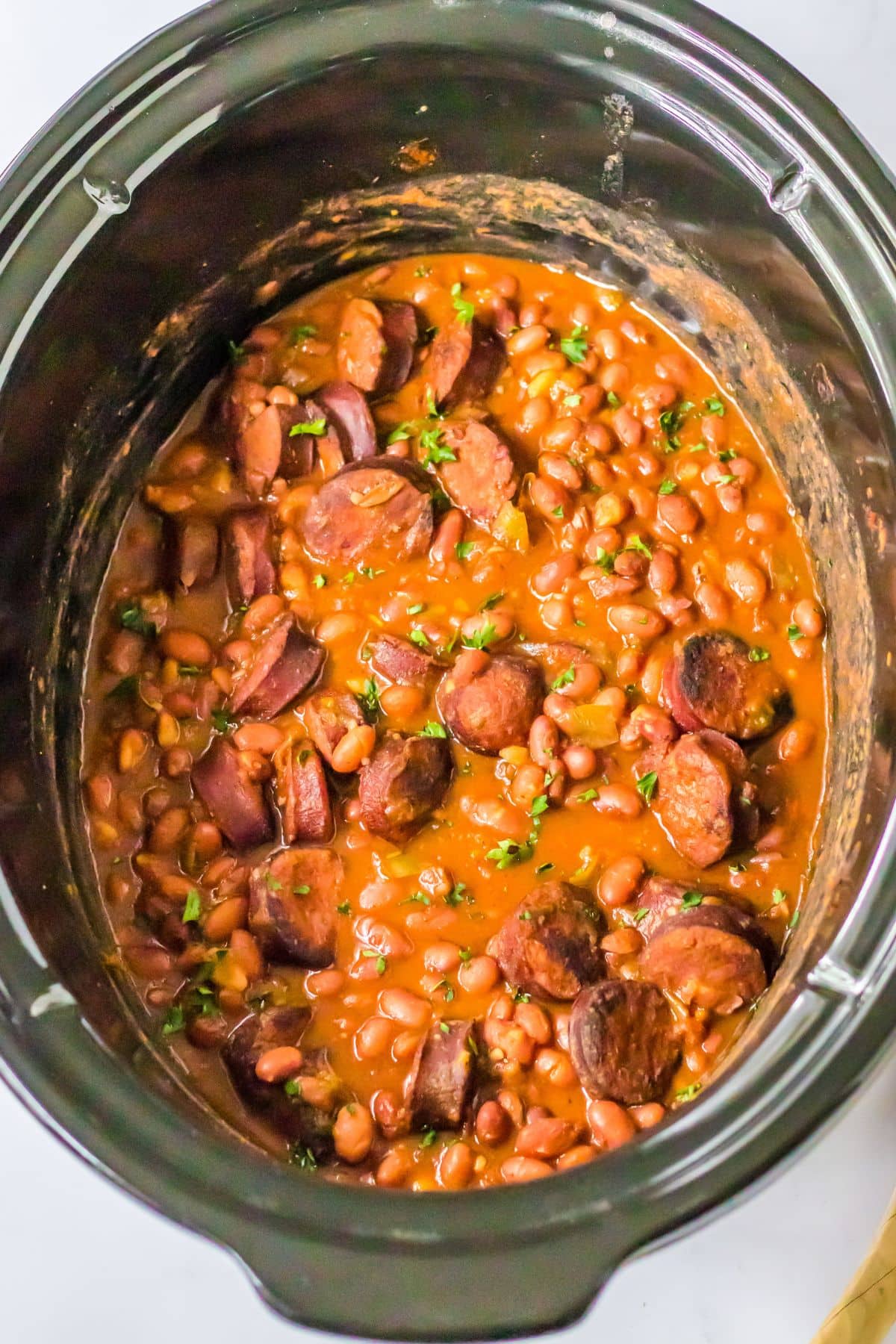 Red beans and sausage in a slow cooker.