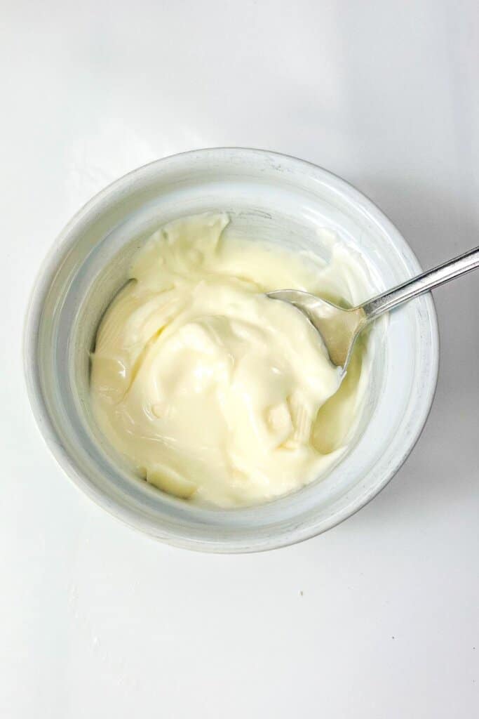 Melted white chocolate in a bowl.