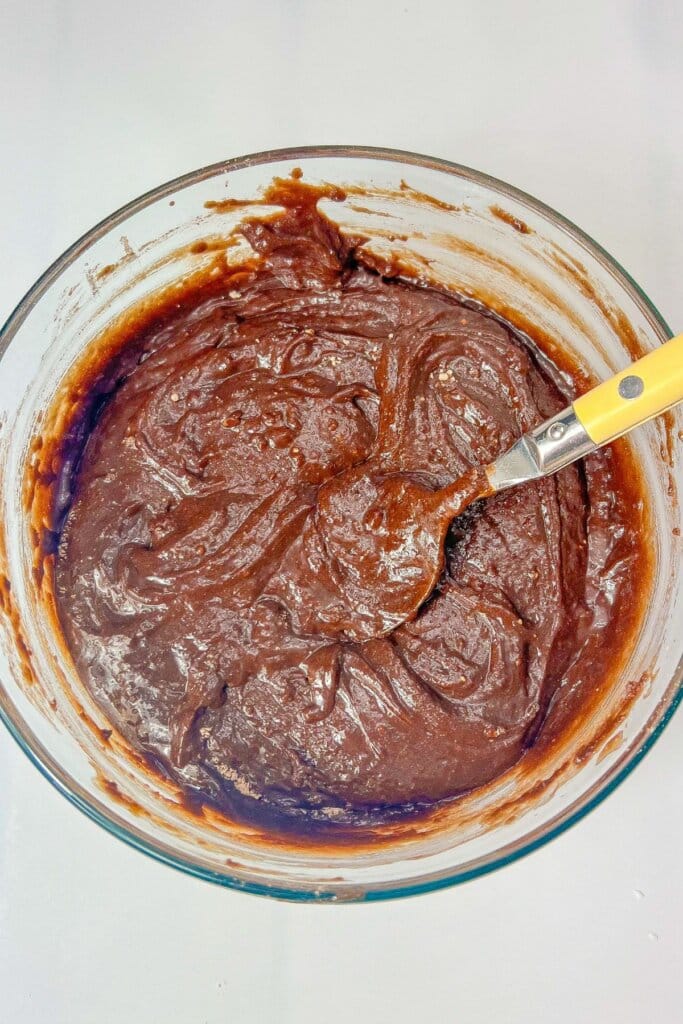 Batter being mixed in a bowl.
