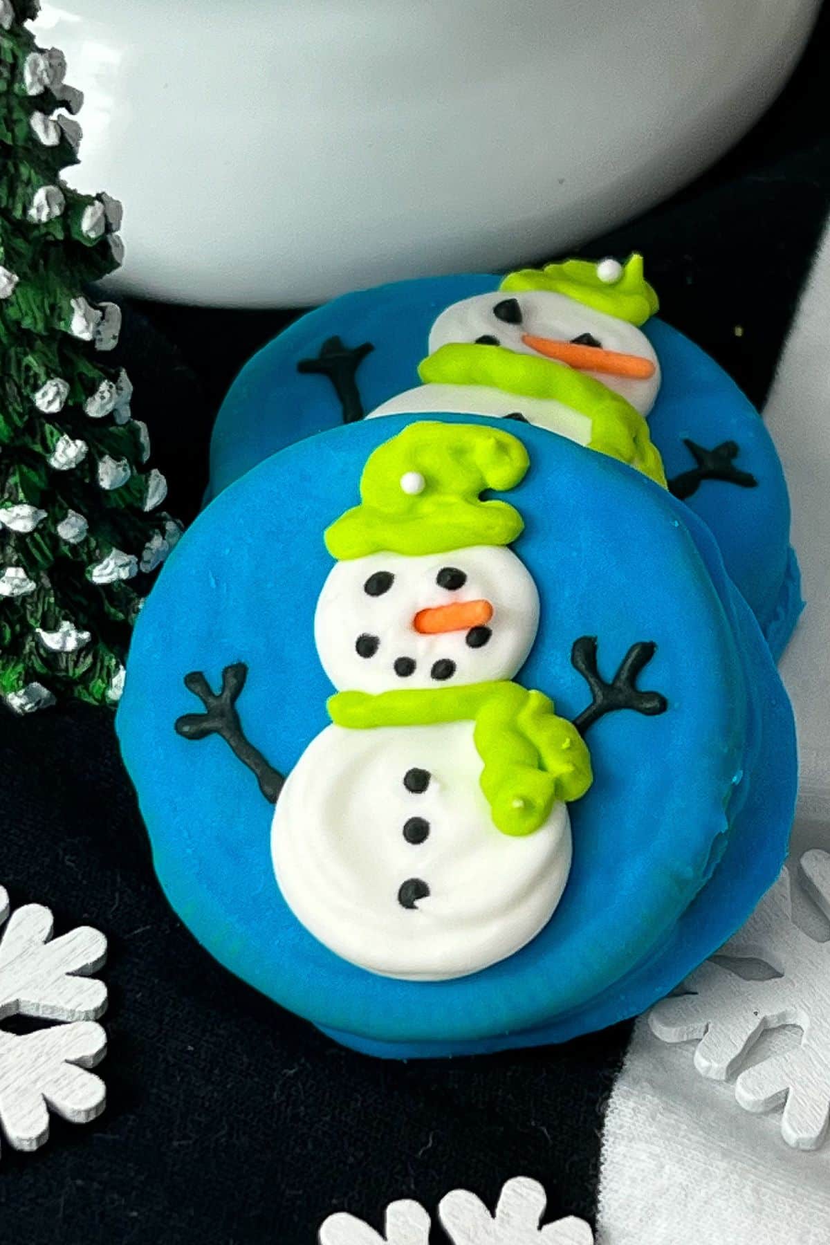 Snowman oreo cookies on table.