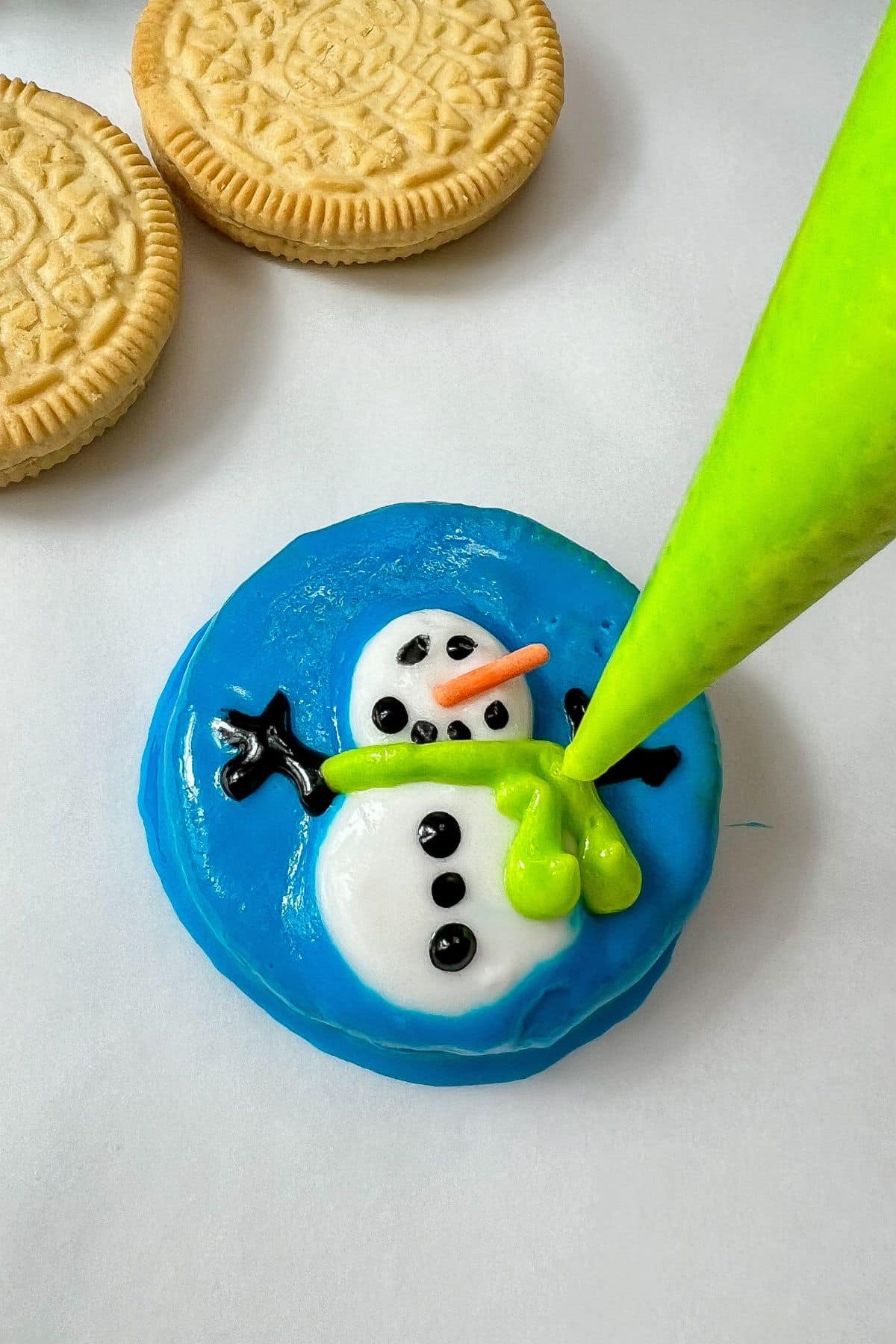 Decorating a cookie with frosting.