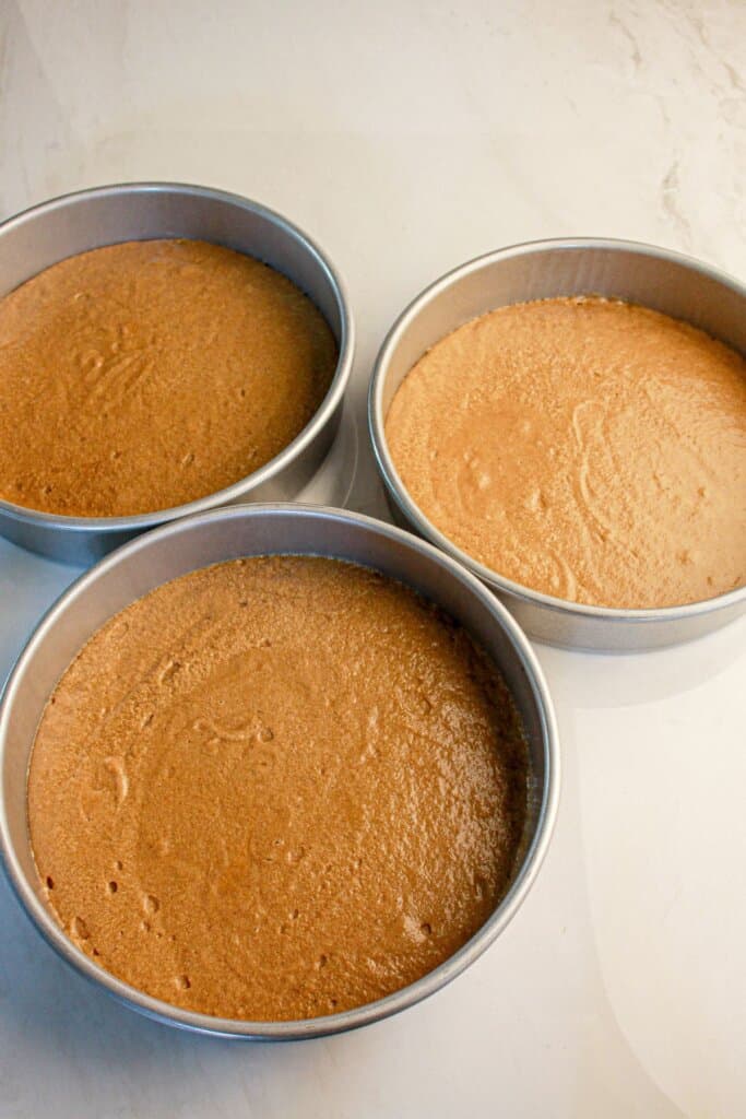 Cake batter in cake pans.