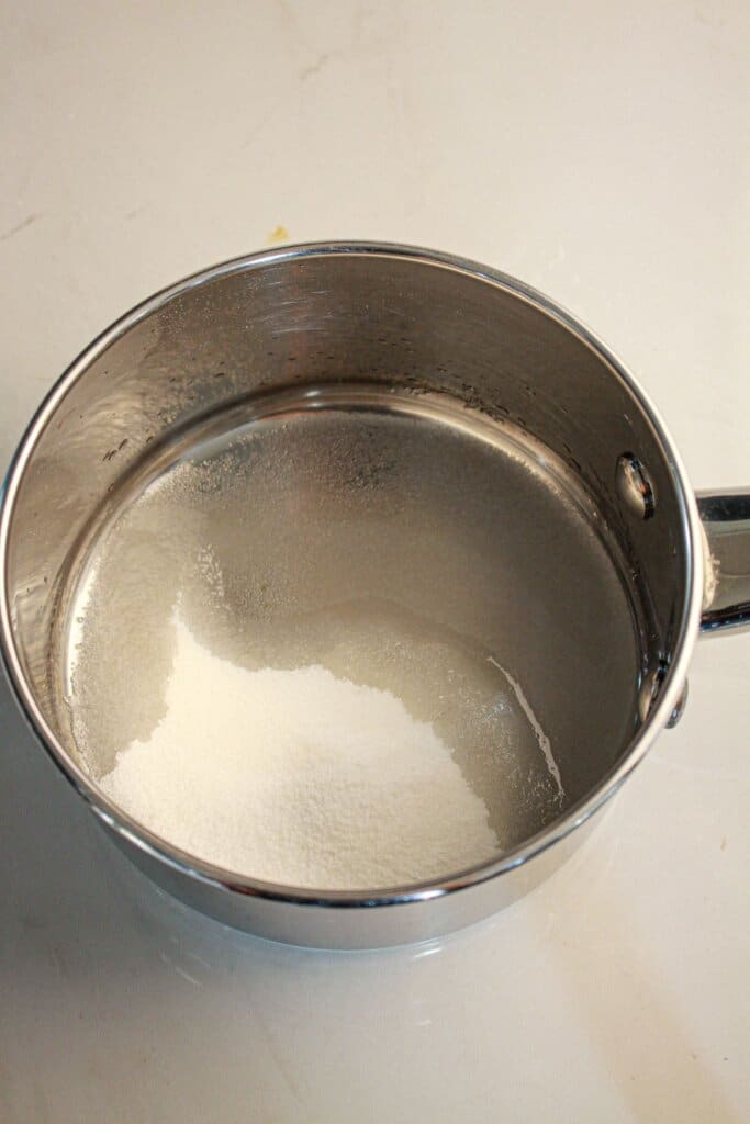 Sugar and water in saucepan.