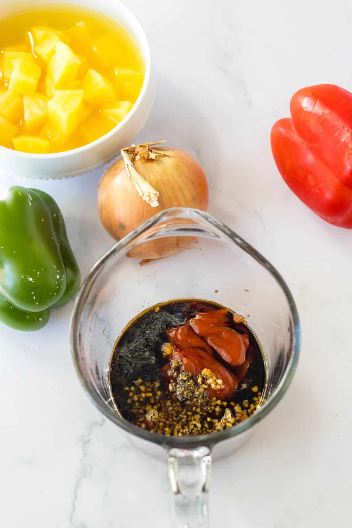 Sauce being mixed in a measuring cup.