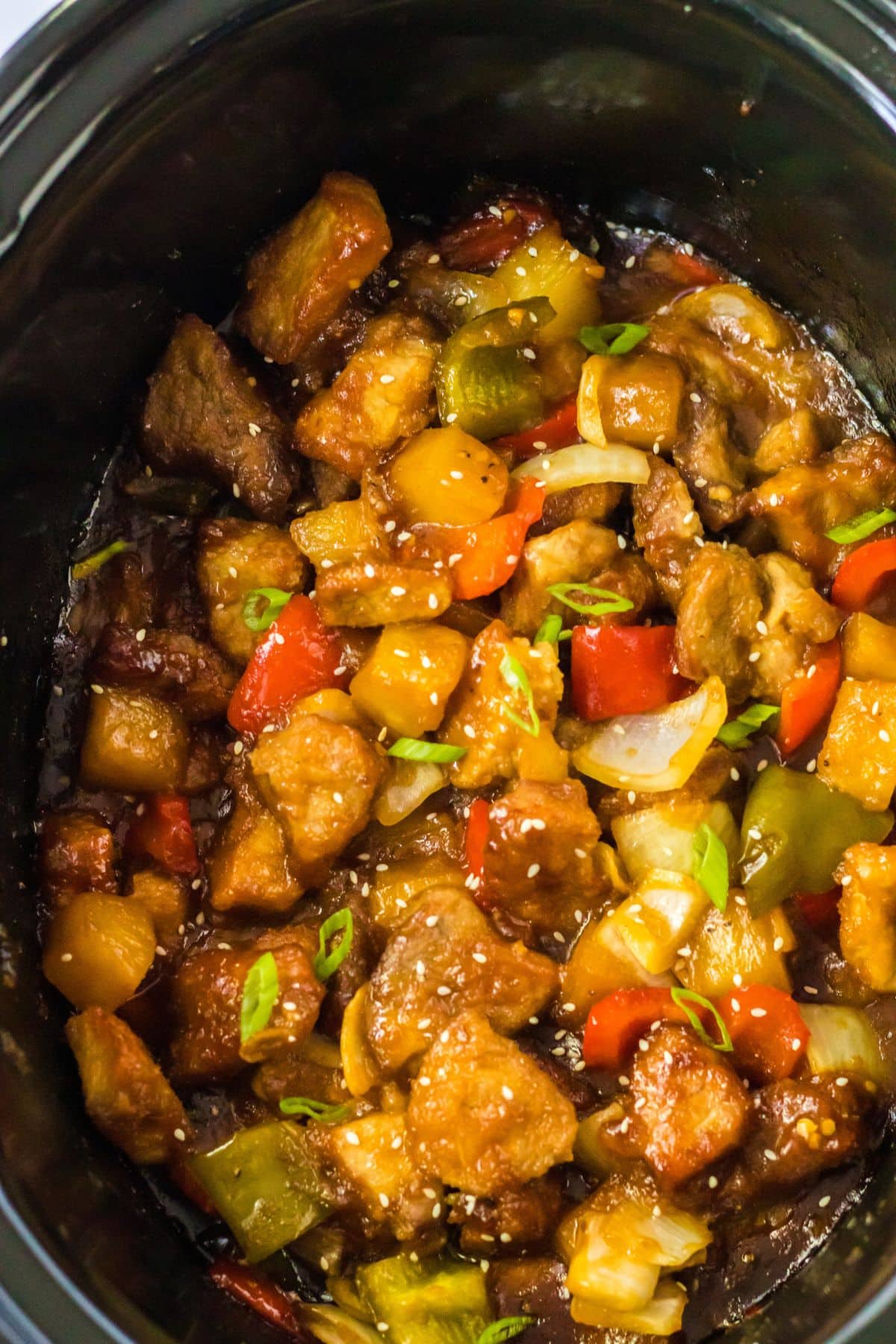 Sweet and sour pork in a crock pot.
