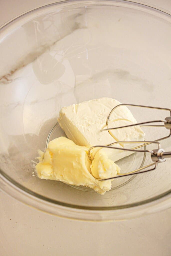 Cream cheese and butter in a bowl.
