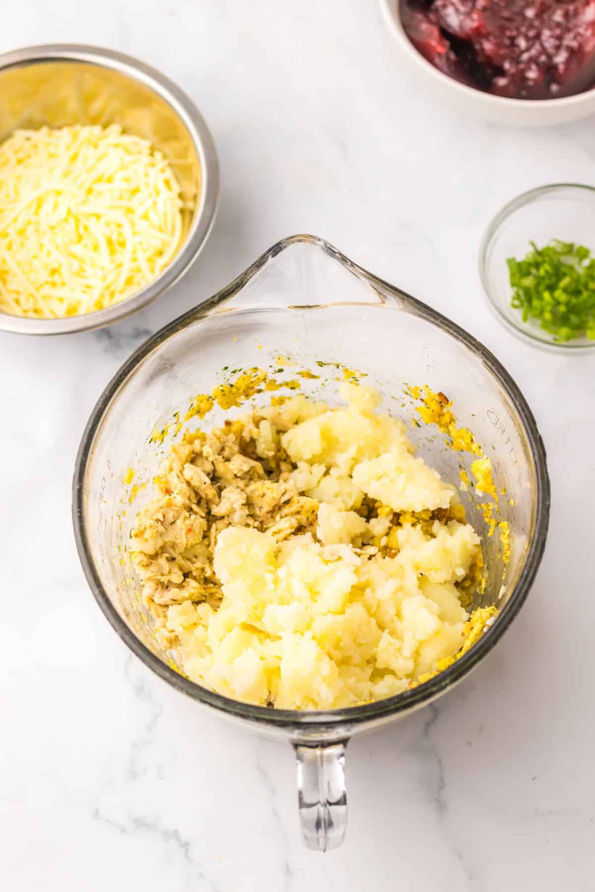 Turkey and stuffing in a mixing bowl.