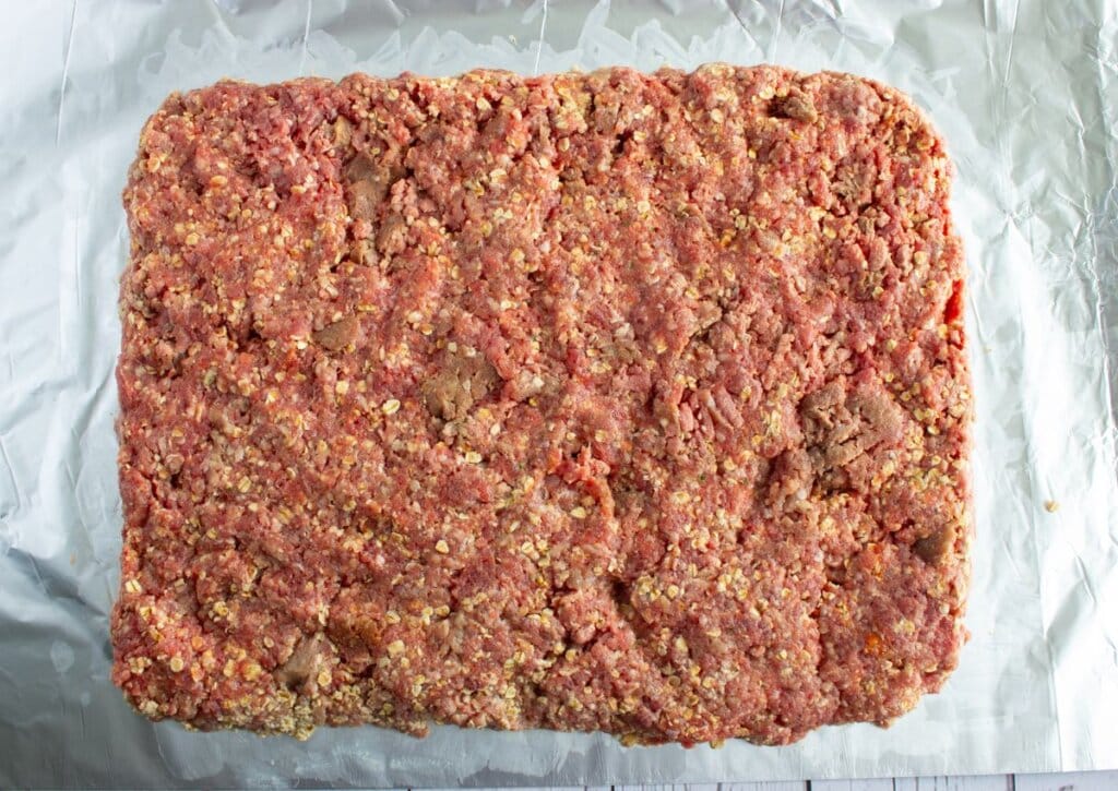 Ground meat patted into a square.
