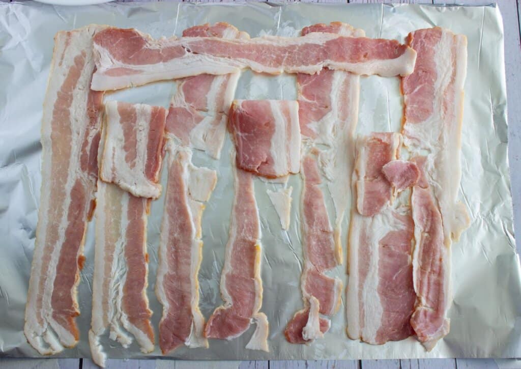Bacon on a baking sheet.