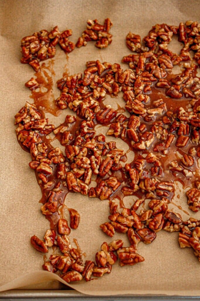 Pecans drying on a baking sheet.