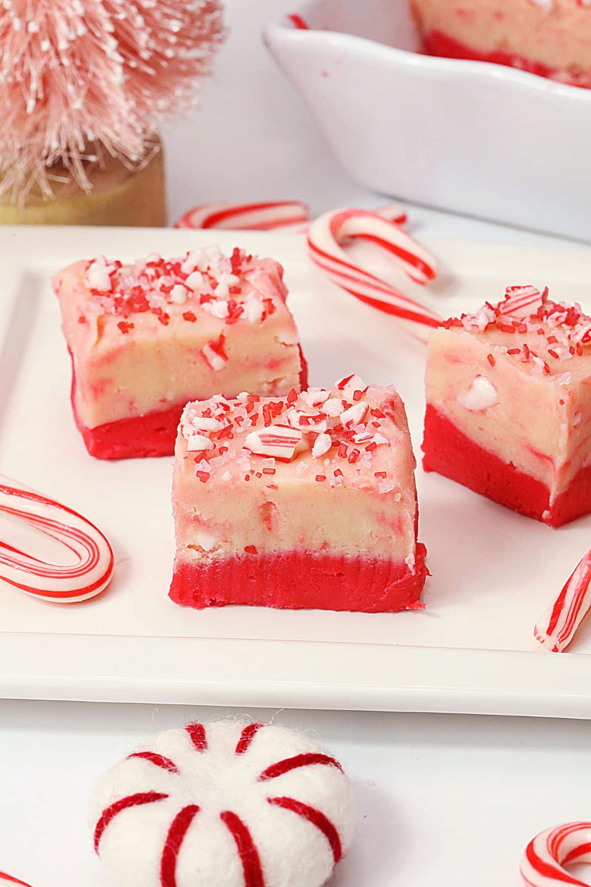 Candy cane fudge pieces on a plate.