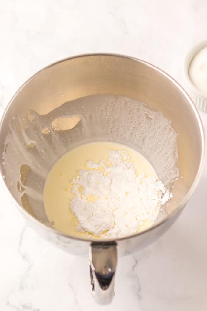 Whipped cream being made in a mixing bowl.