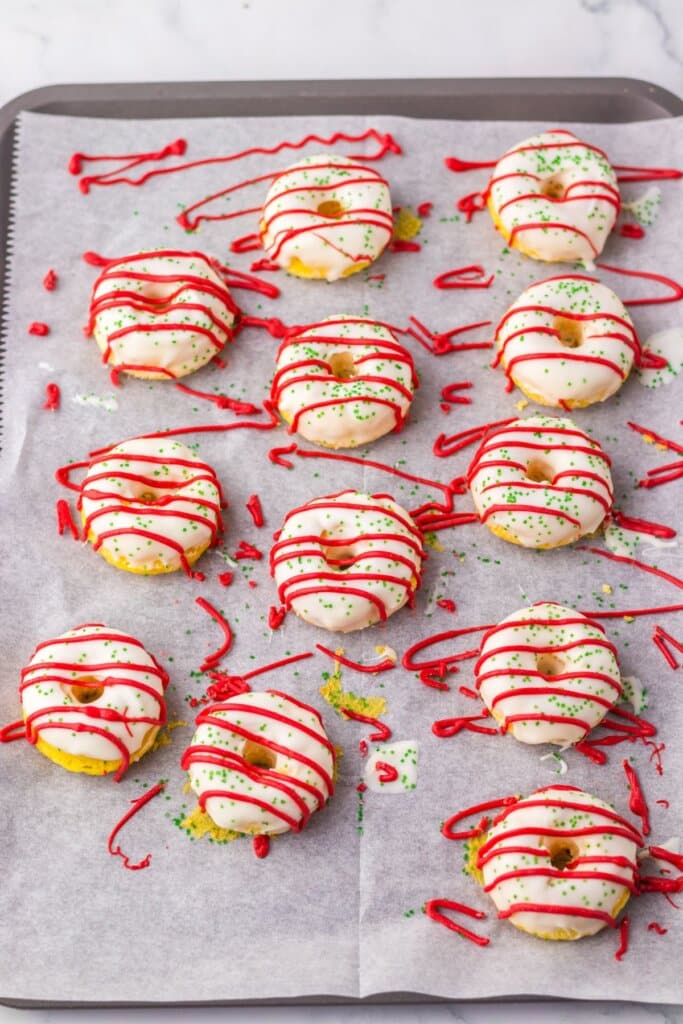 Christmas tree cake donuts on a baking sheet.