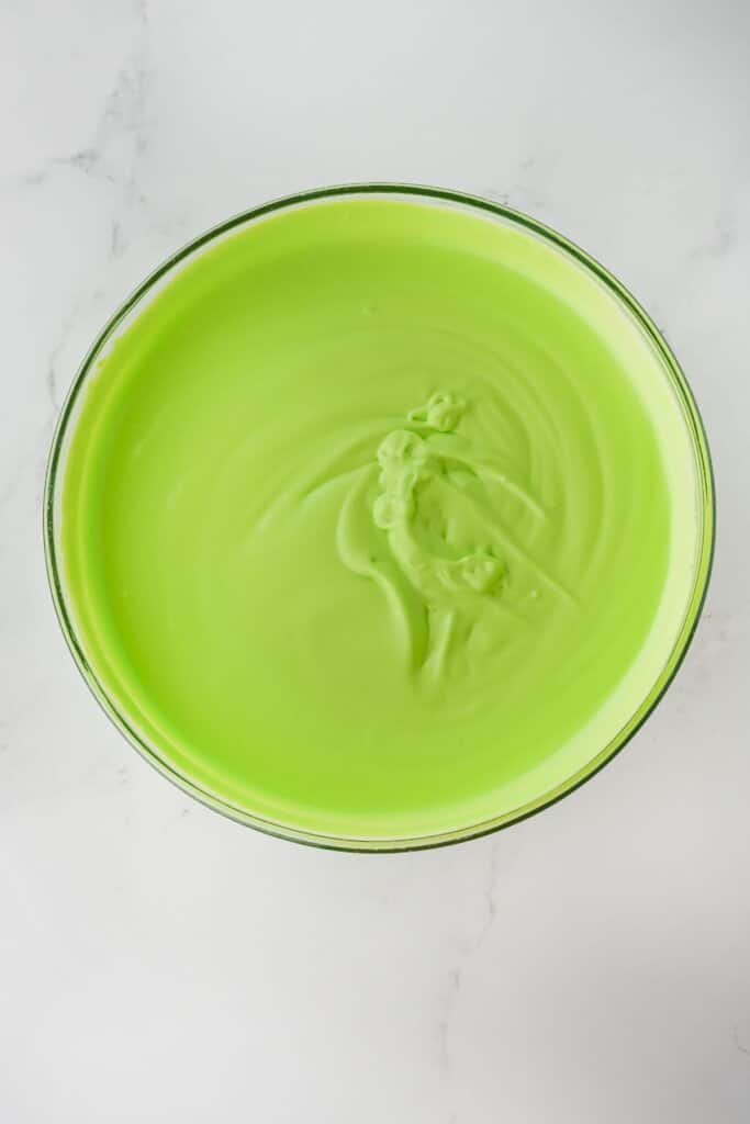Green pudding in a glass bowl.
