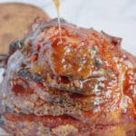 Glaze being poured over ham.