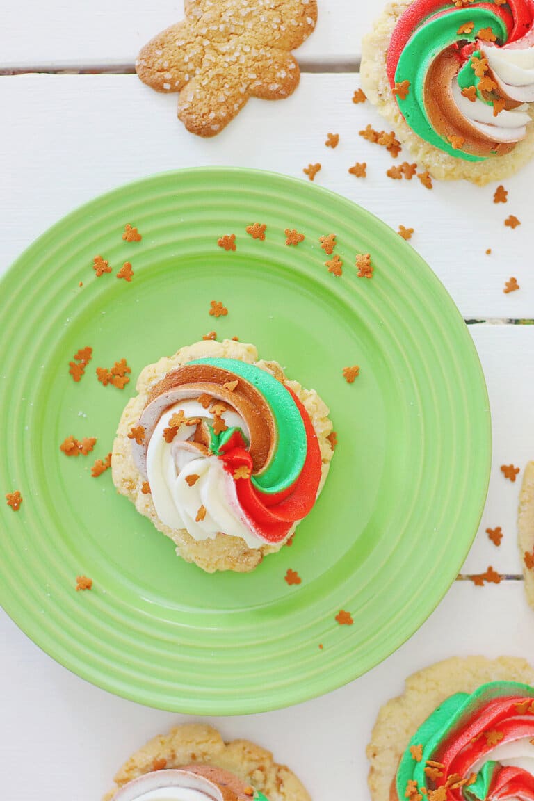 Frosted gingerbread cookie on a plate.