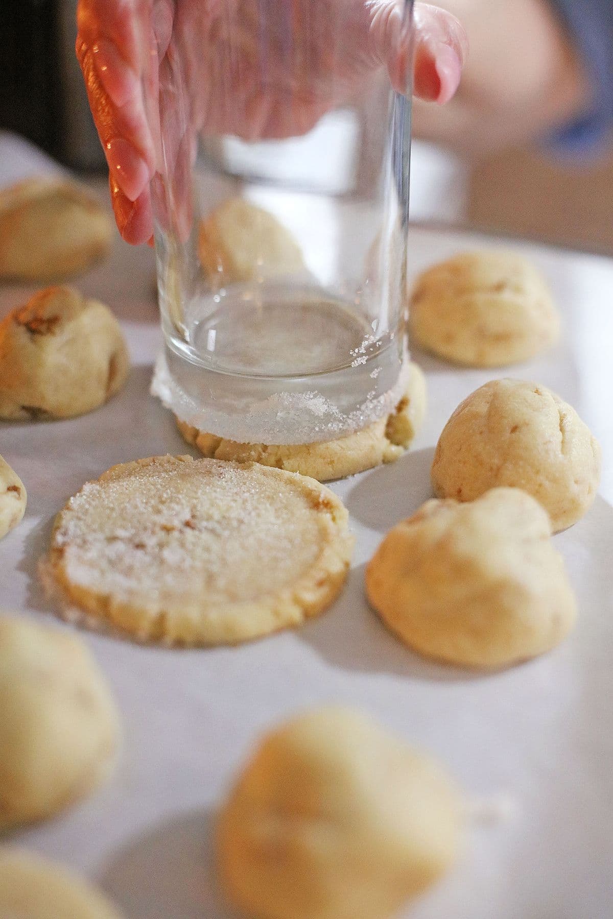 Dough being smashed with a glass.