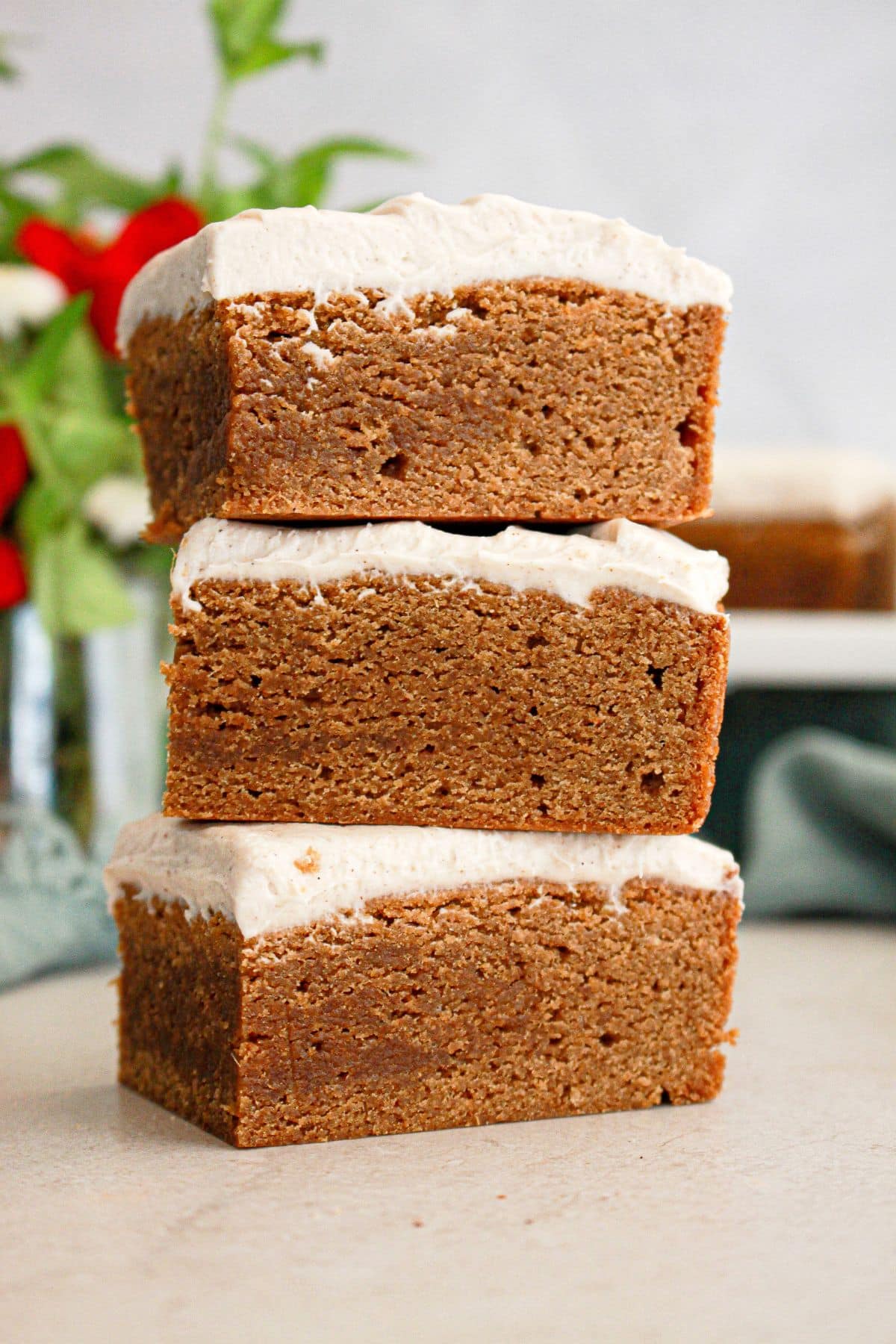 Three gingerbread brownies stacked on top of each other.