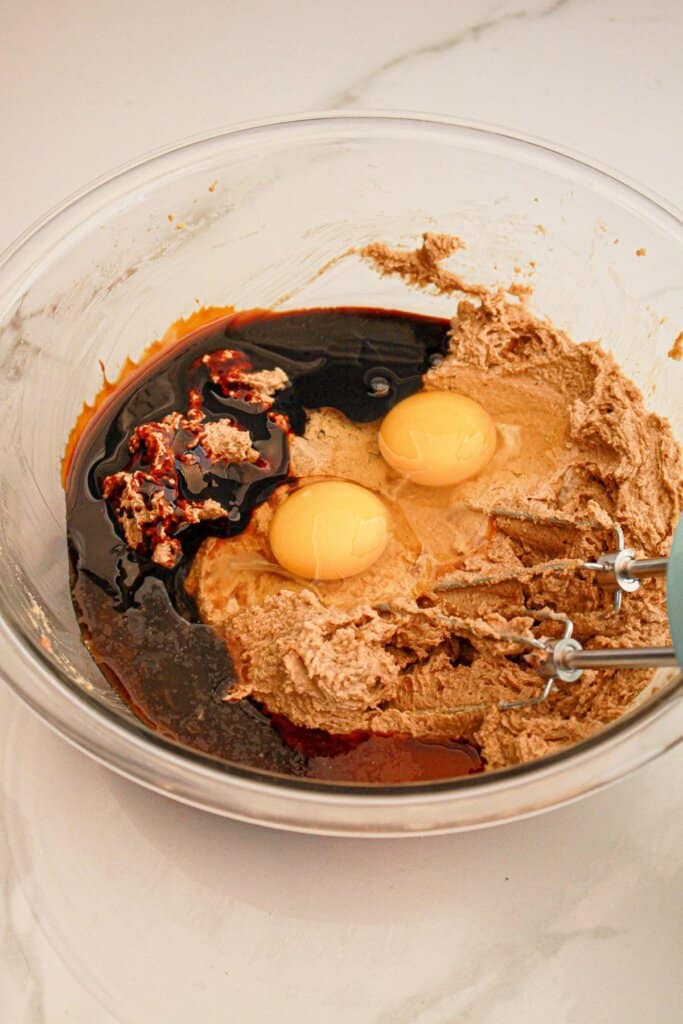 Wet ingredients being mixed in a bowl.