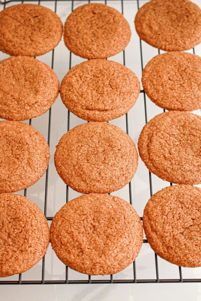 Cookies cooling on a wire rack.