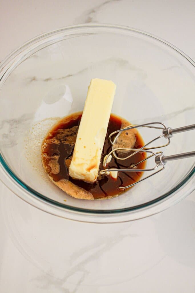 Butter and vanilla being mixed together.