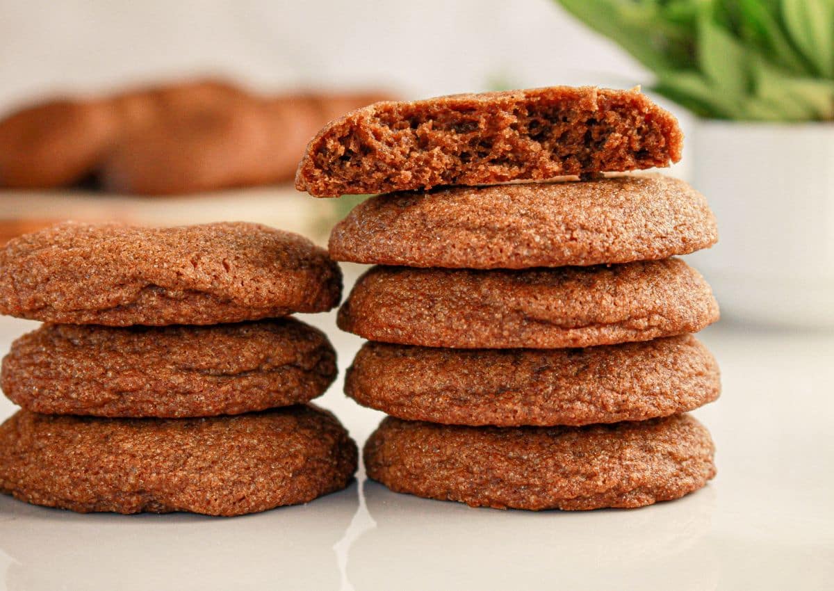 Cookies stacked on table.