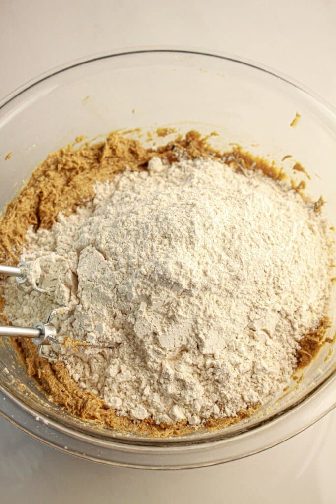 Dry ingredients being added to cookie dough.