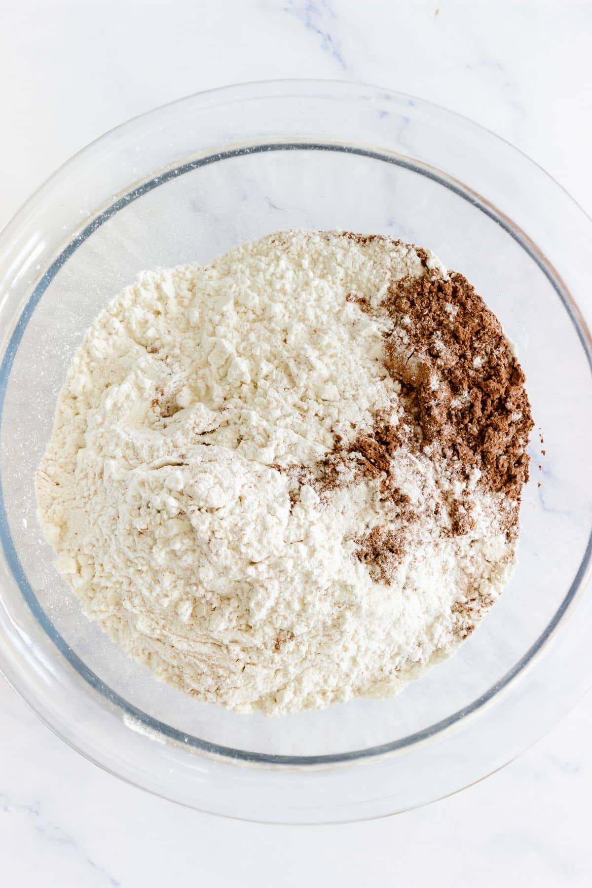 Dry ingredients in a glass mixing bowl.