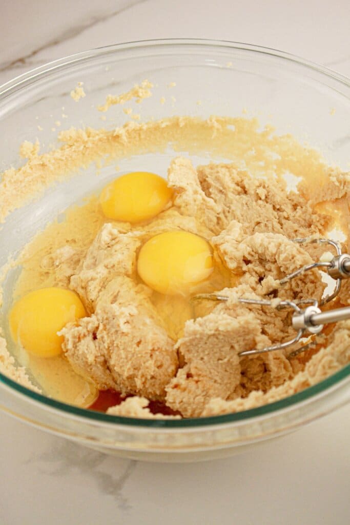 Batter being mixed in a glass bowl.