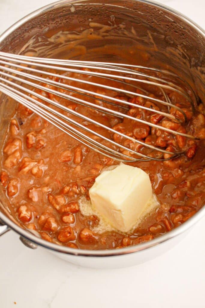 Pecan filling being mixed in a saucepan.