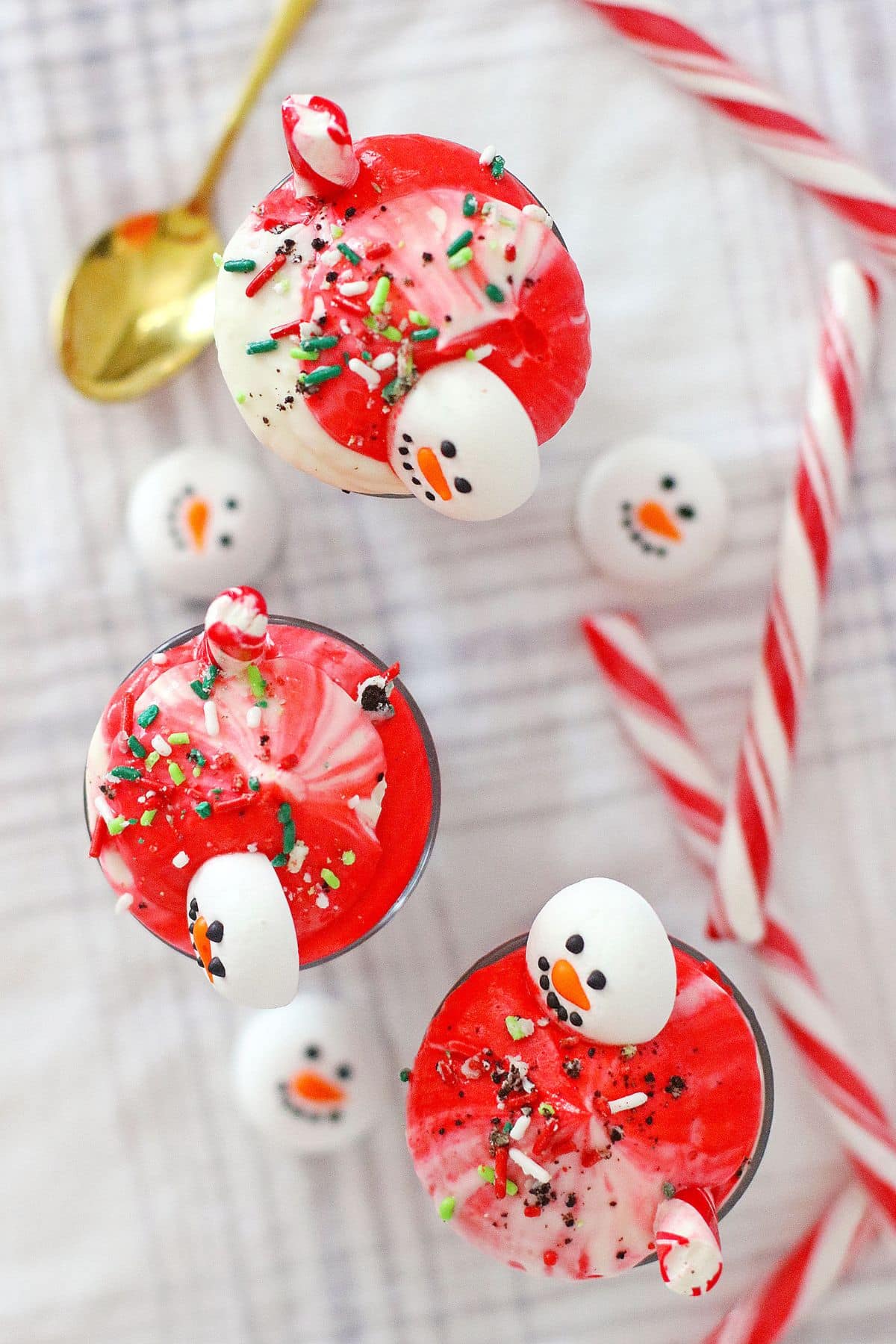 Three peppermint parfaits on a table.