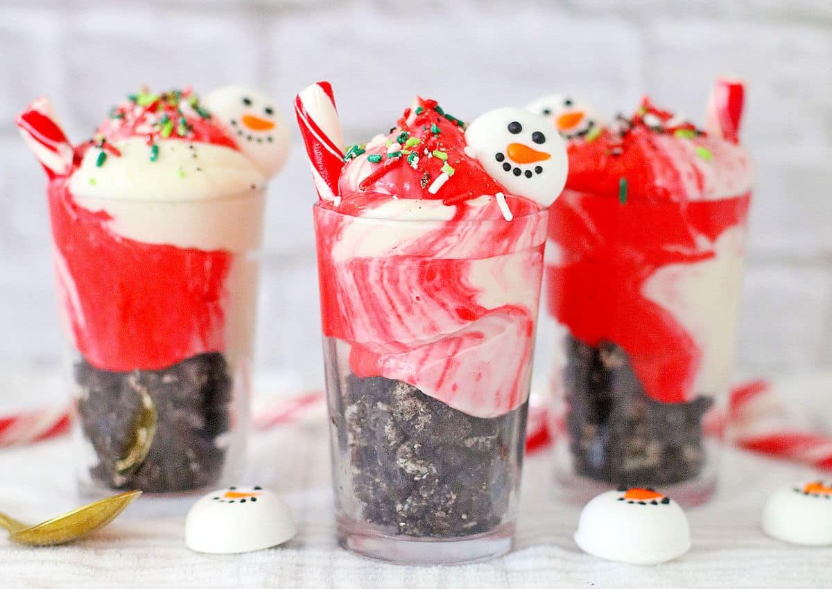 Three peppermint parfaits on a table.