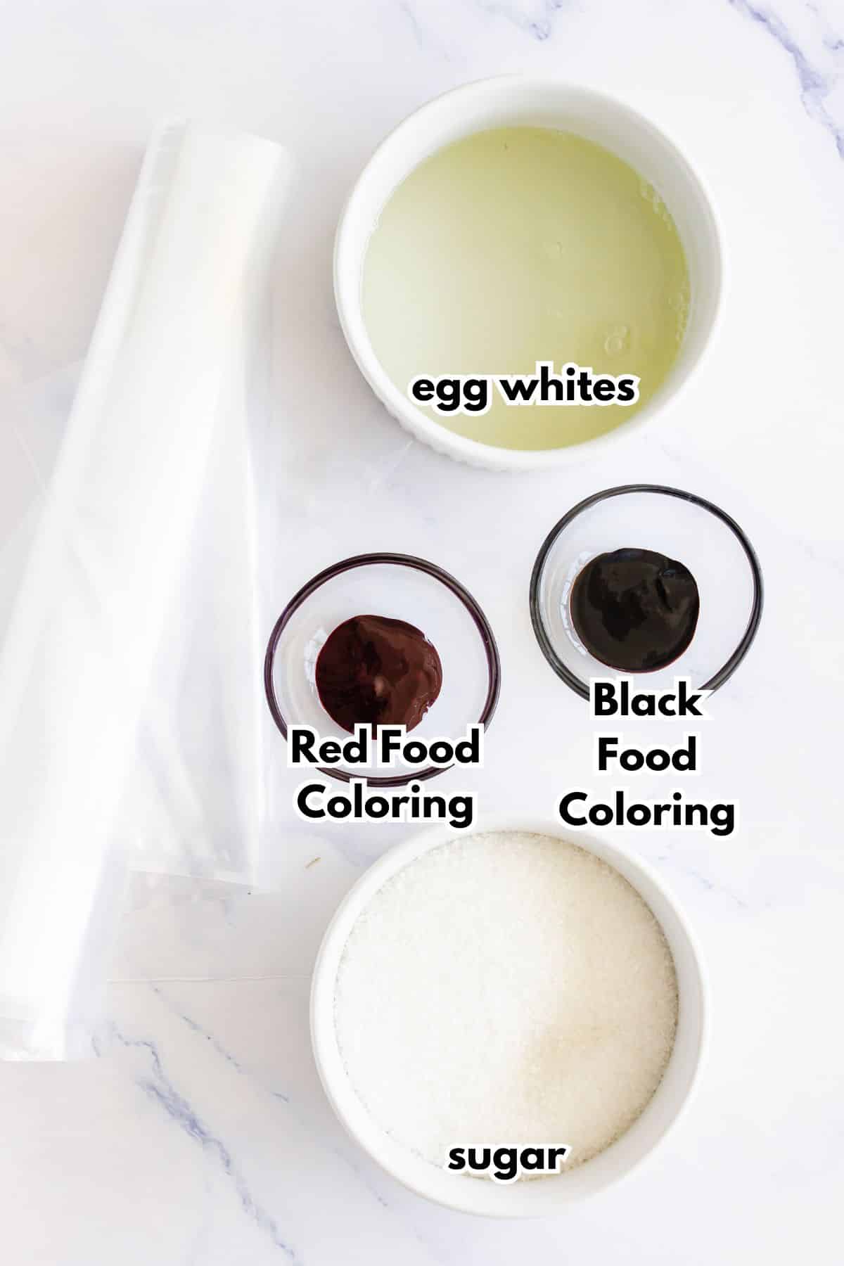 Bowls of ingredients labeled with text on a counter.