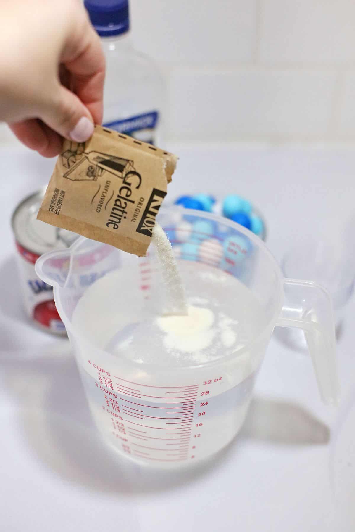 Gelatin being added to water.