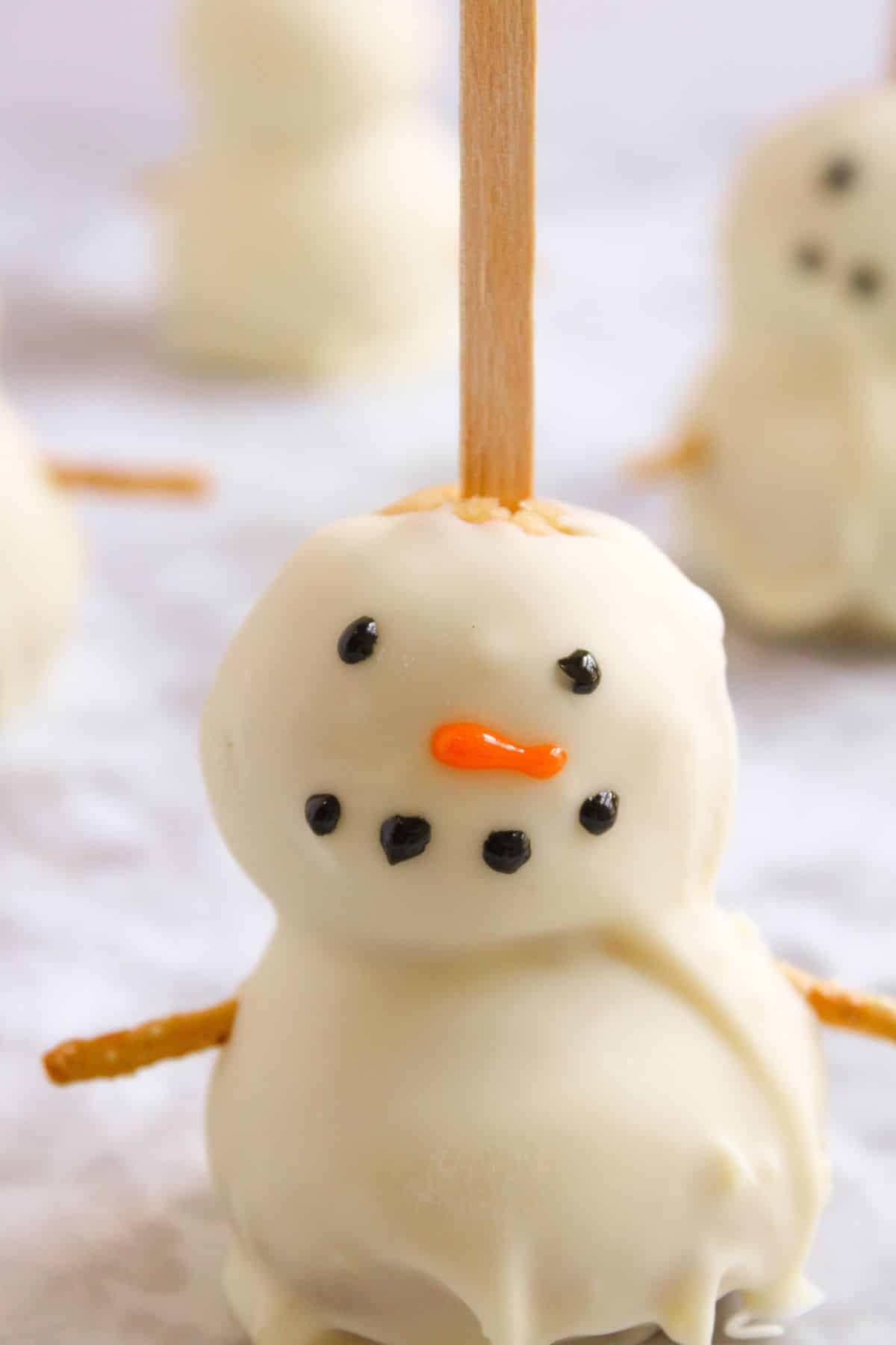 Face being added to cake pop.