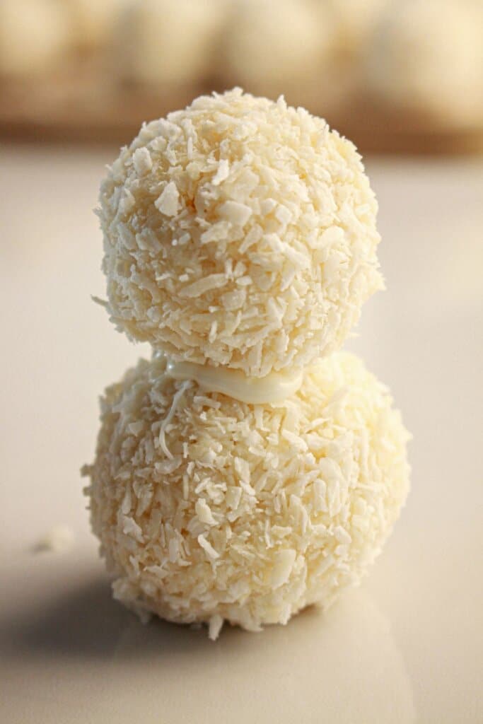 Coconut balls stacked on top of each other.