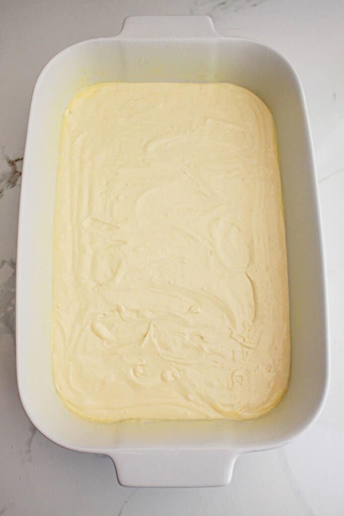 Cake batter in a baking dish.