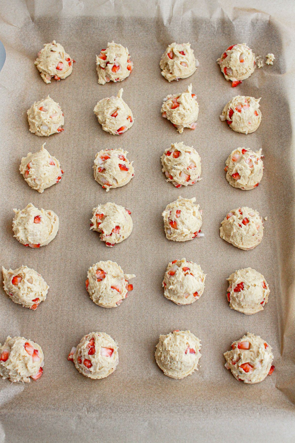 Dough balls on parchment paper.