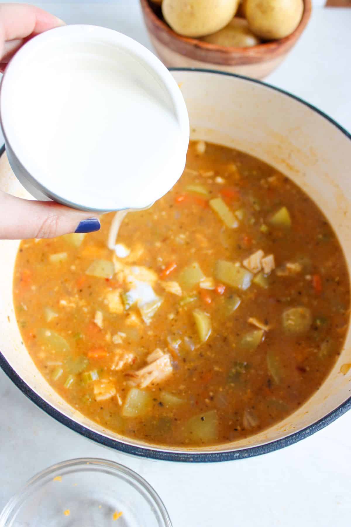 Cream being added to soup.