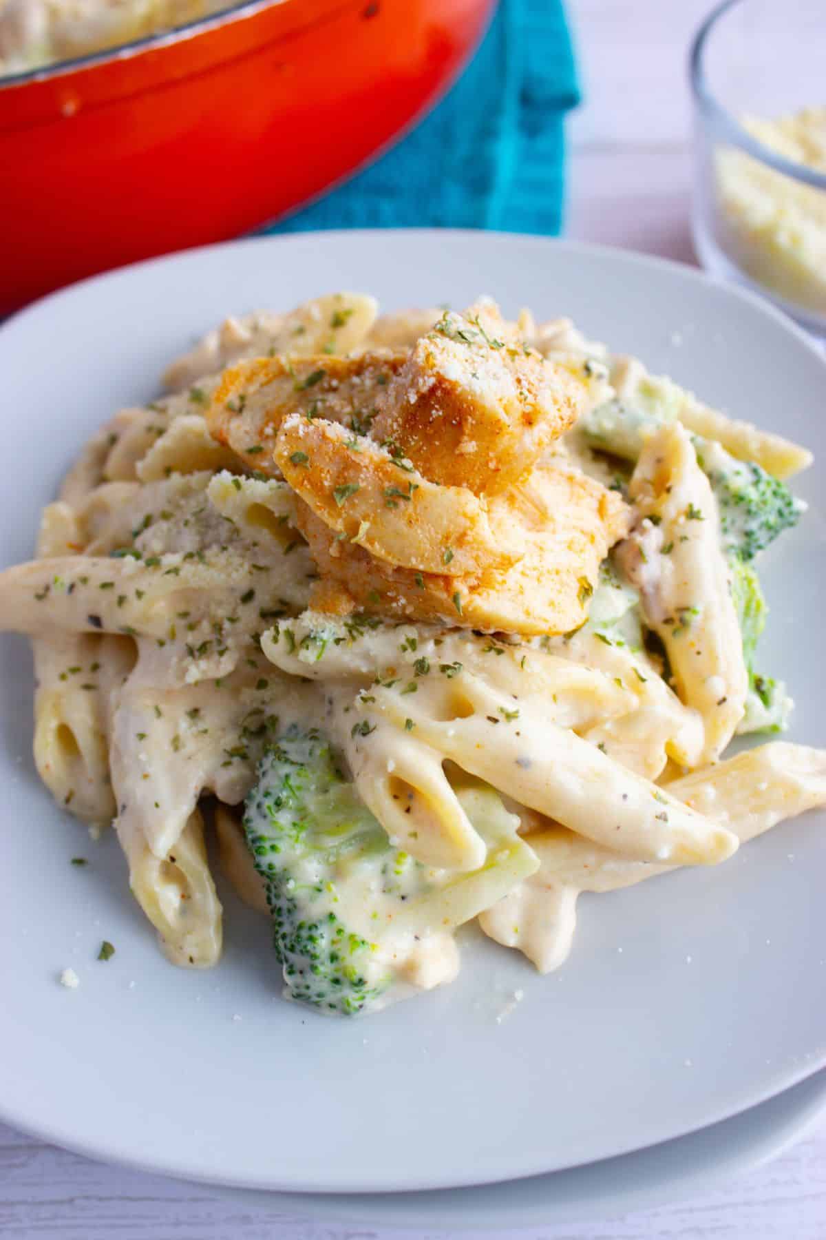 Plate full of chicken broccoli pasta.