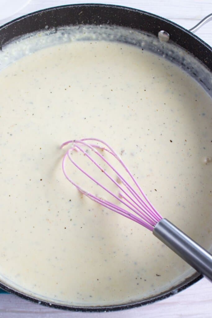 Cream sauce in a skillet.