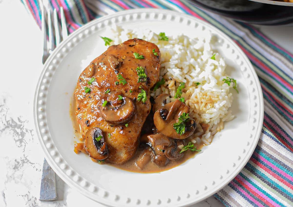 Chicken and rice on a plate.