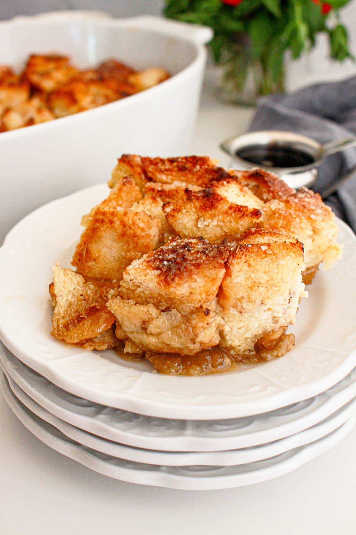 Slice of creme brulee french toast casserole on a plate.