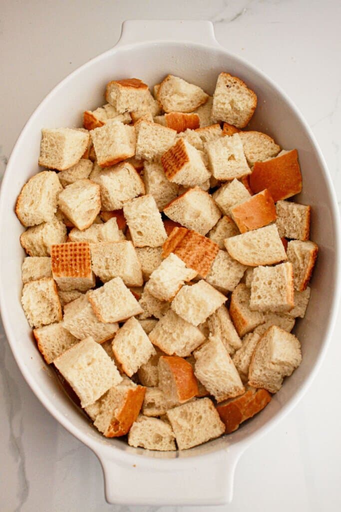 Bread pieces in a baking dish.