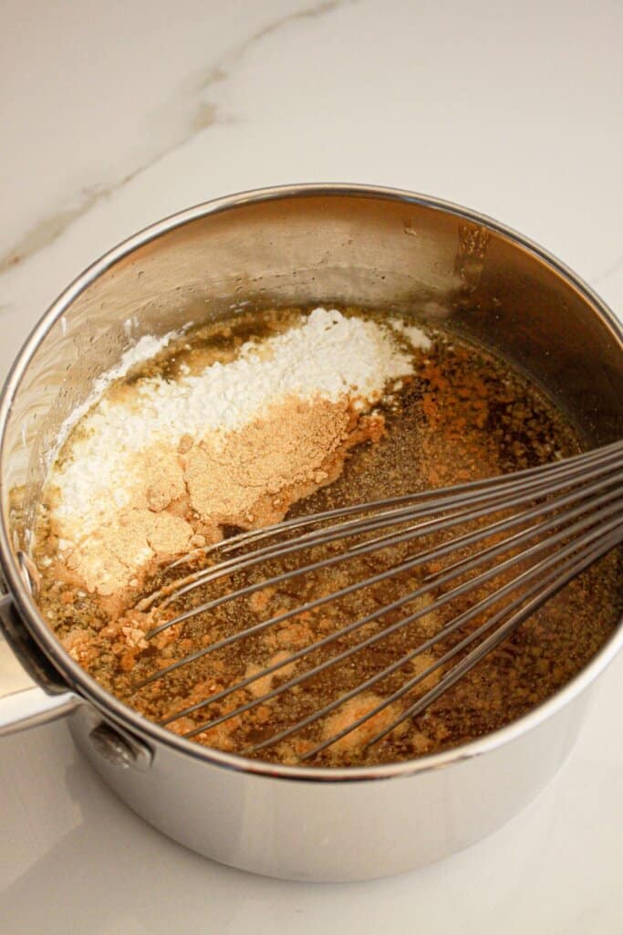 Broth and seasoning in a pot.