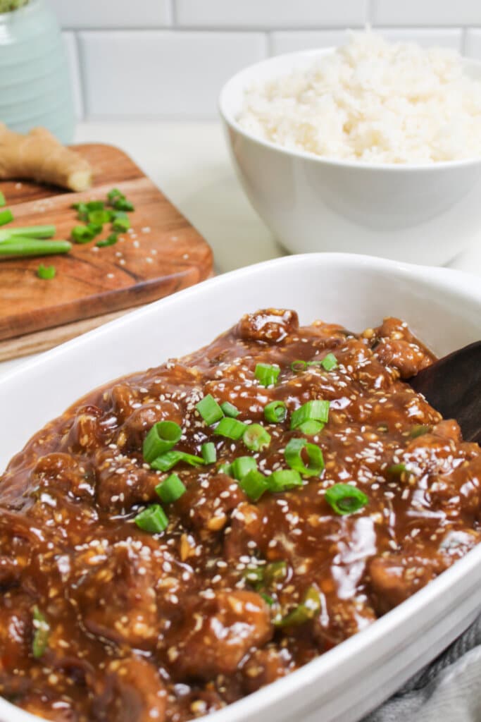 Serving bowl filled with flank steak teriyaki.