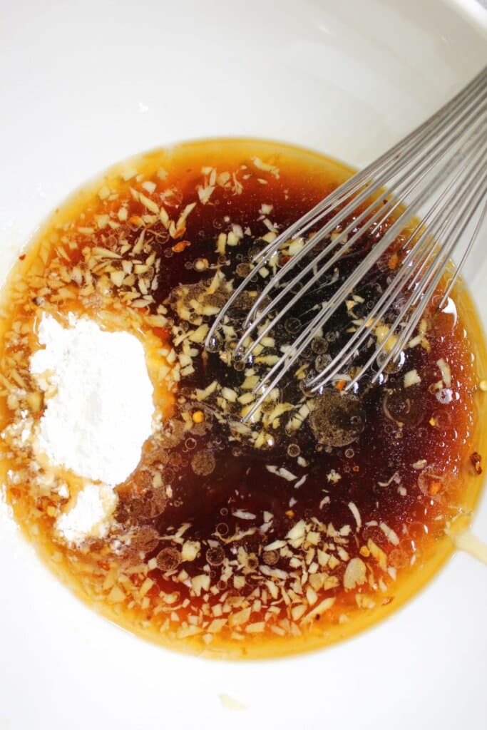 Sauce being mixed in a bowl.