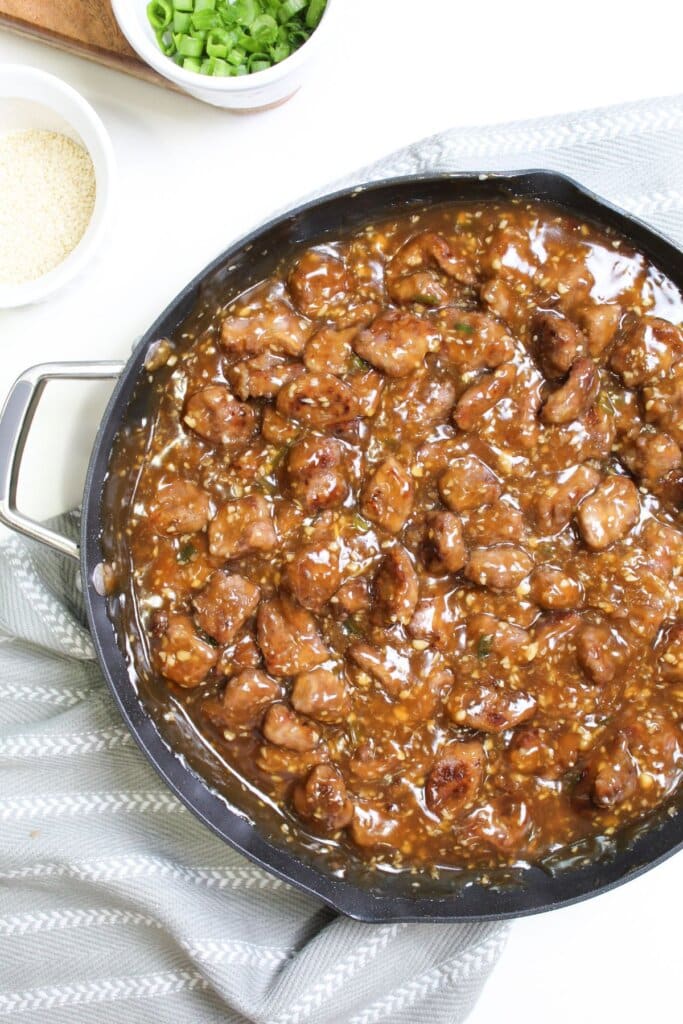 Beef teriyaki in a skillet.
