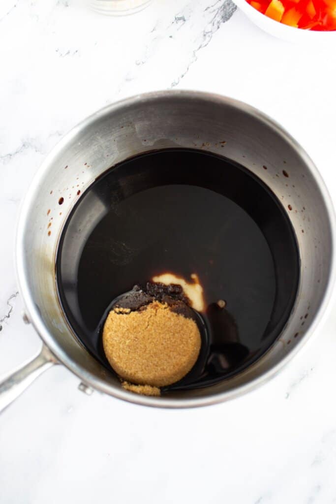 Soy sauce and brown sugar in a saucepan.